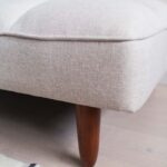 solid wood sofa cum bed front view tufted cushions rustic woods